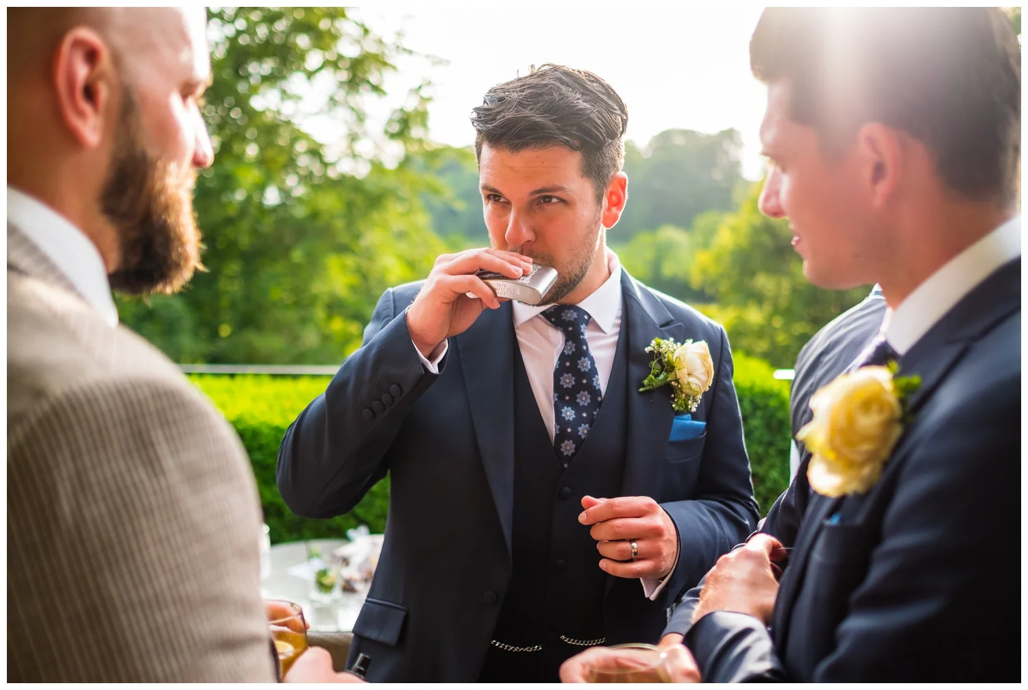 groomsmen with hip-flask