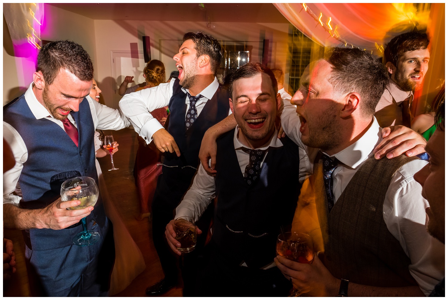 groom and guys dancing