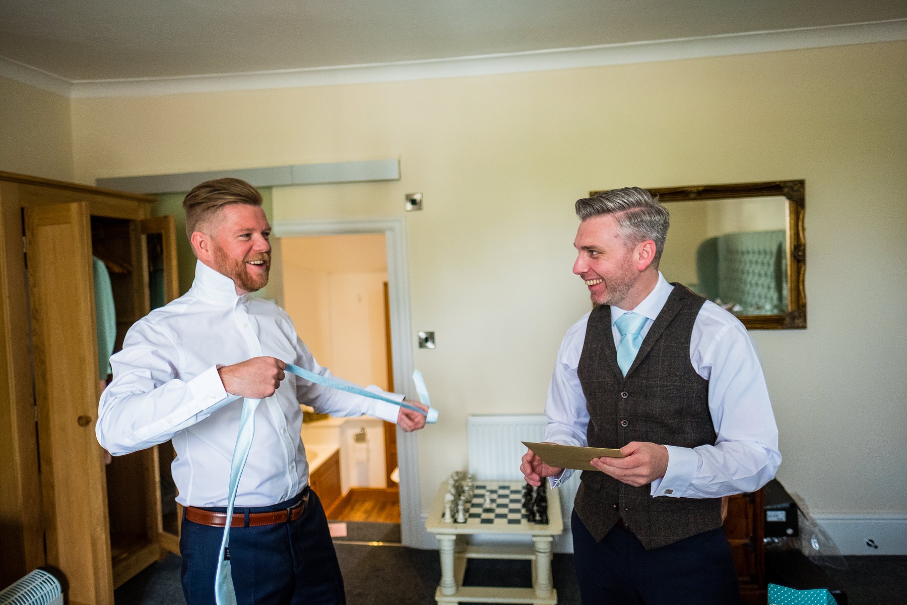 groom and best man getting ready