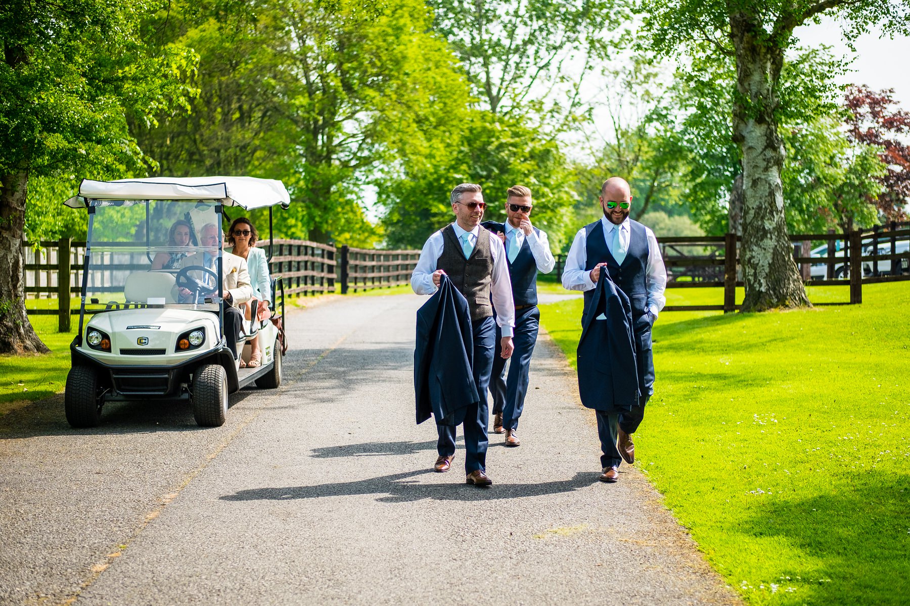 groomsmen walking to venue
