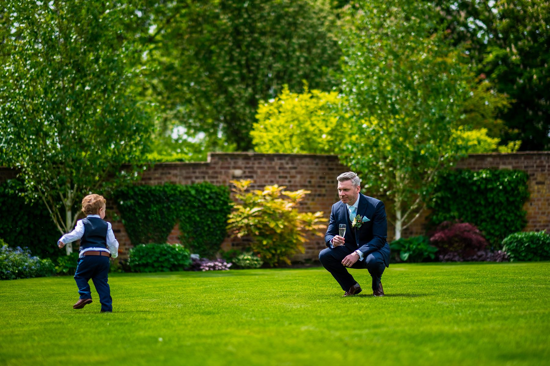 groom playing with son