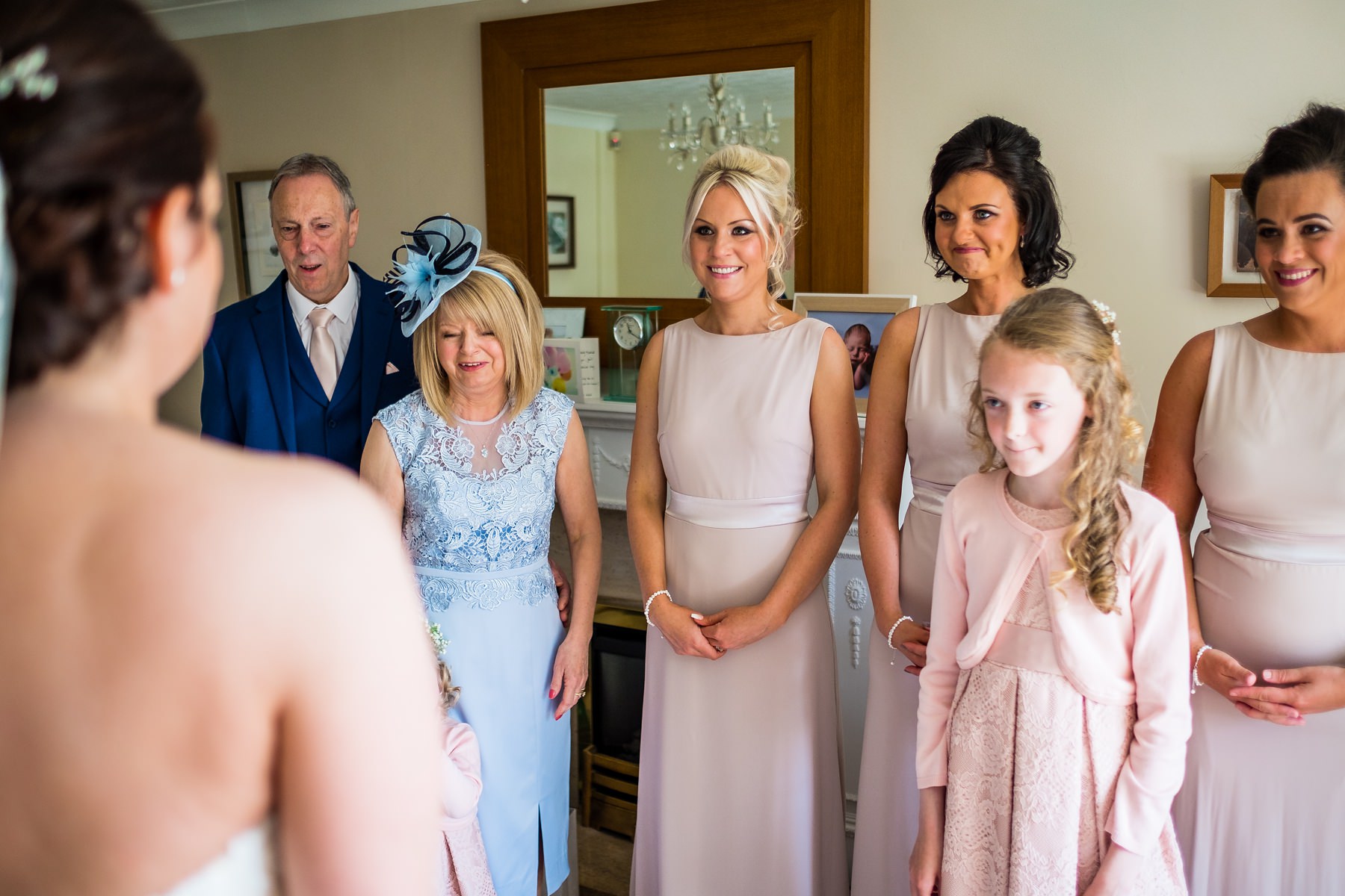 family seeing bride for the first time in dress