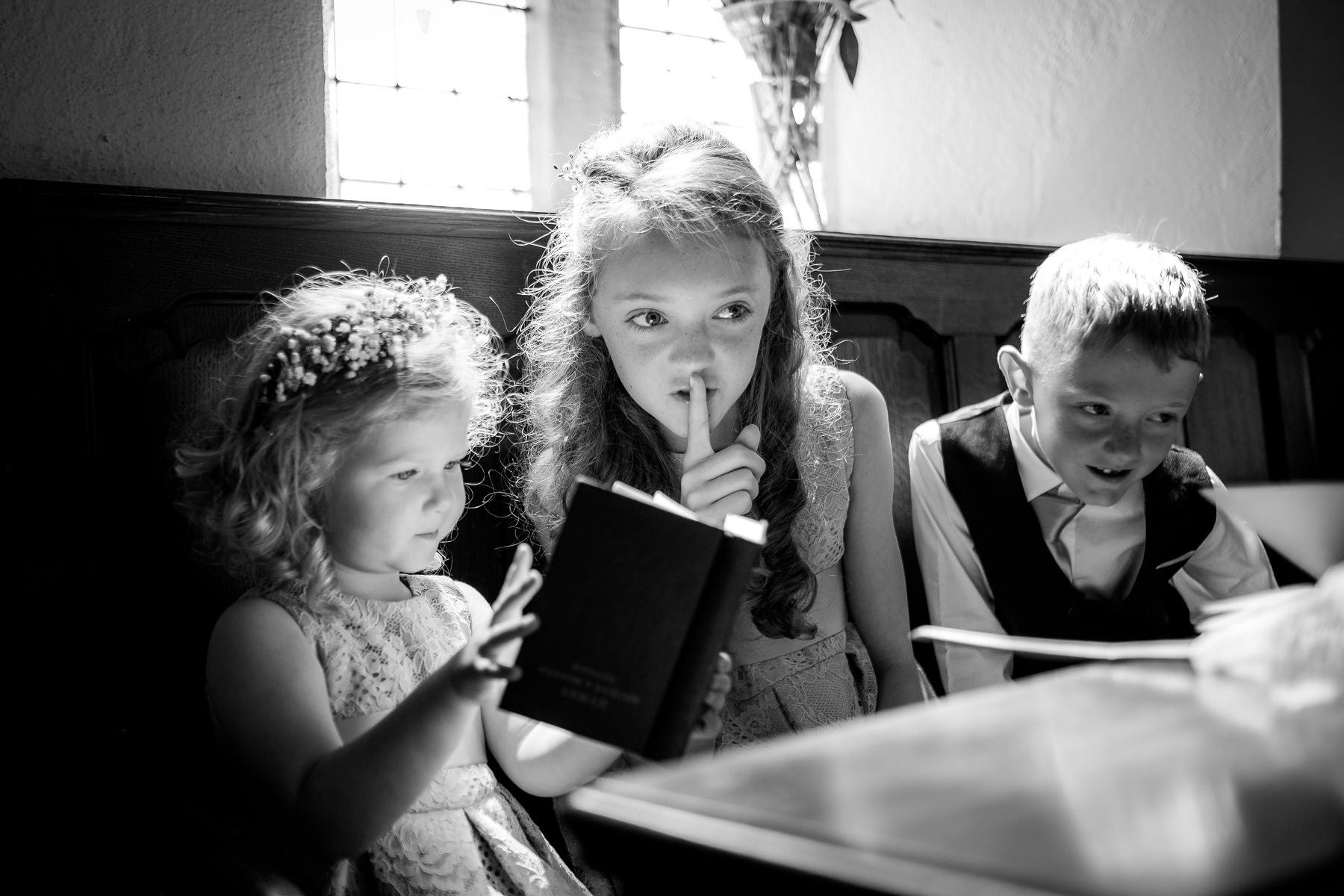 flower girl telling children to be quiet