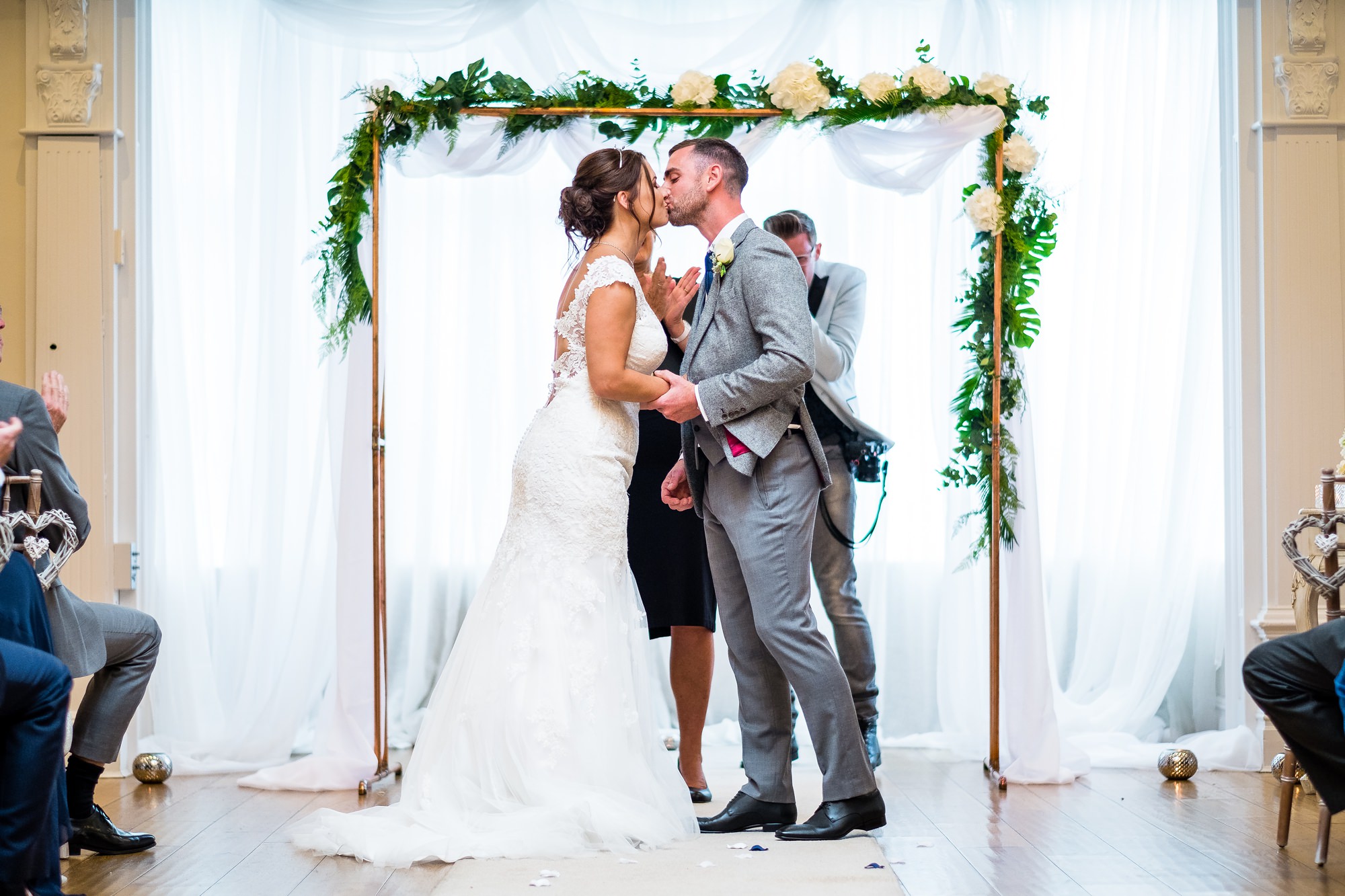 bride and groom first kiss