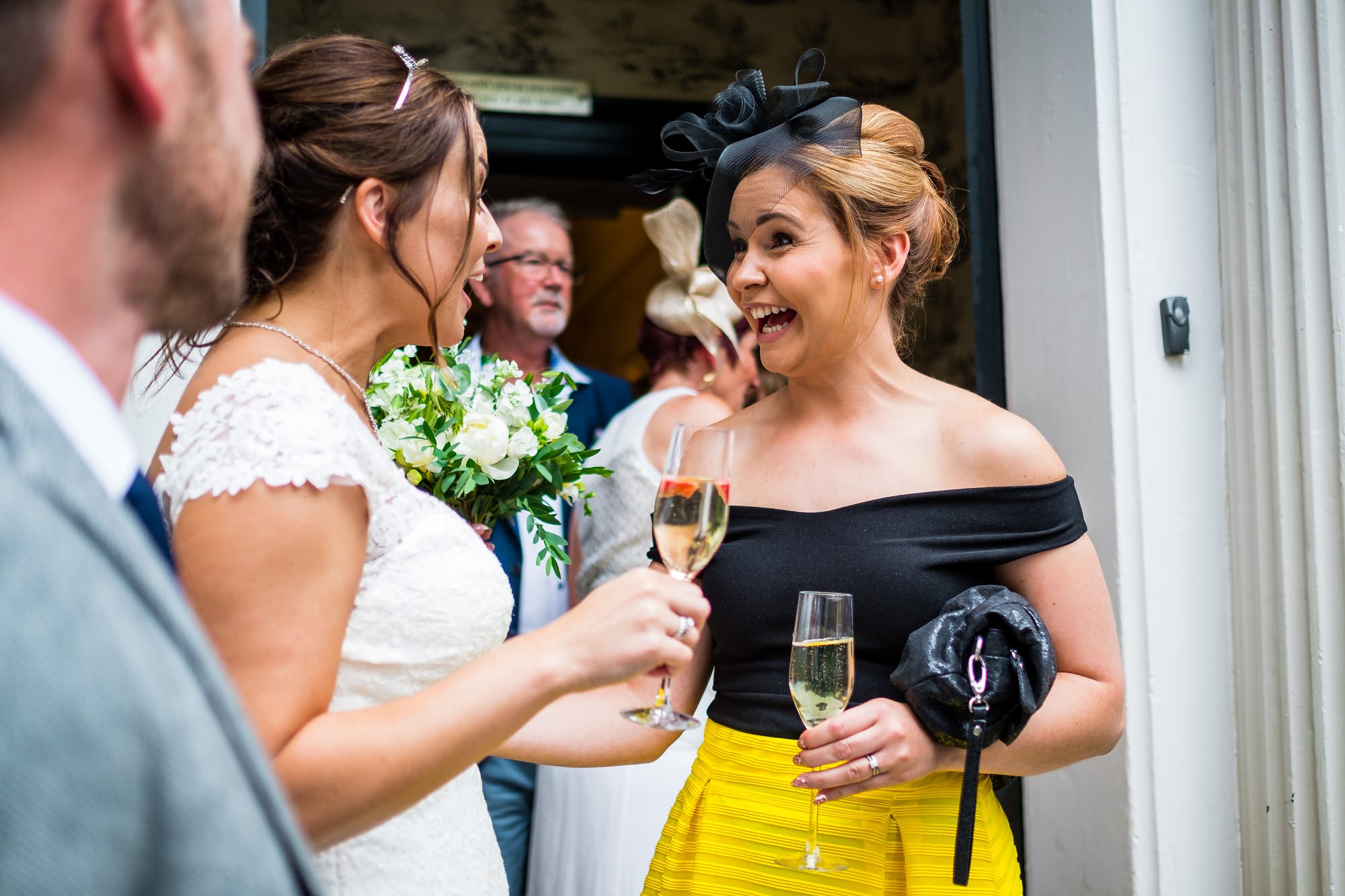 guest smiling at bride