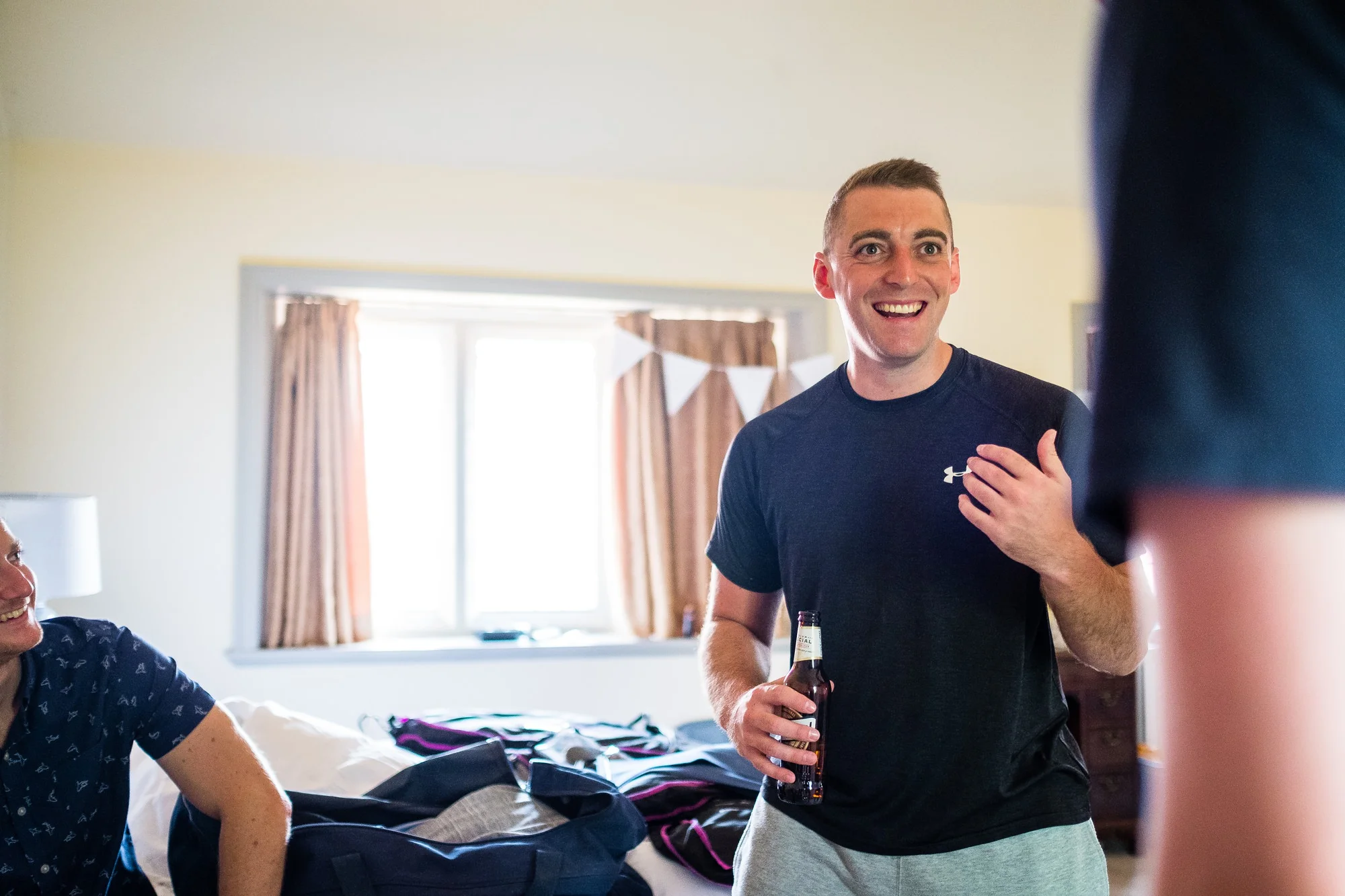 groom smiling during preperations