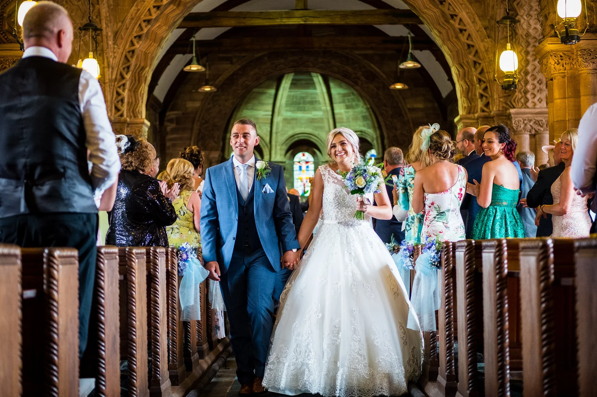 bride and groom walking down the aisle