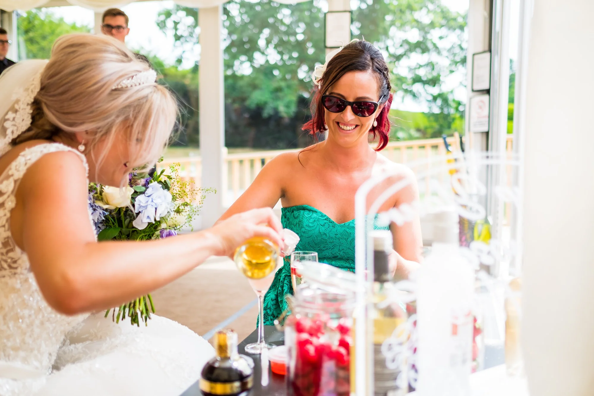 bride making gin with friend