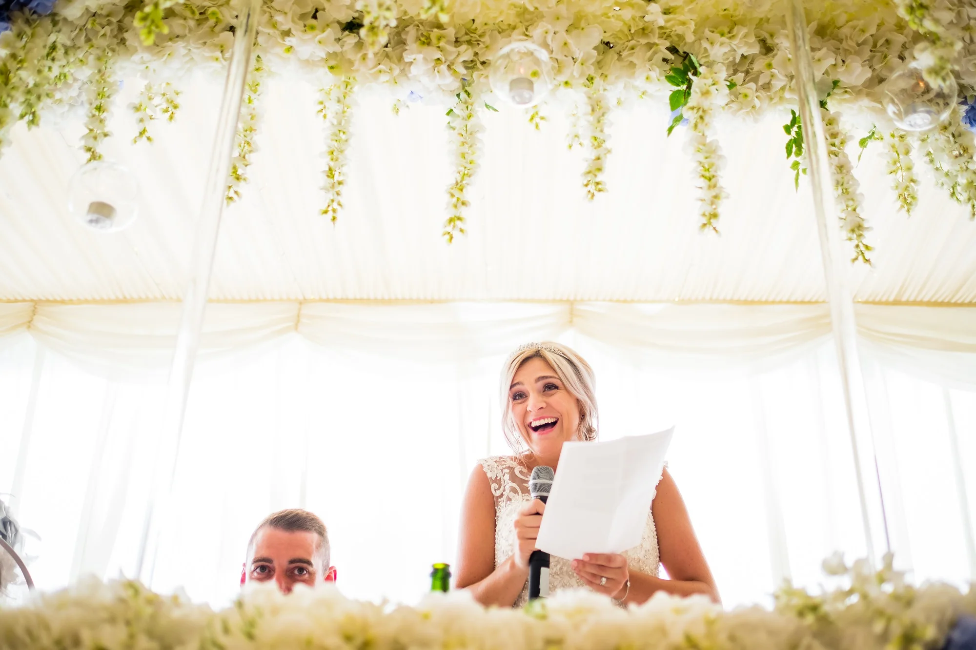 bride laughing during speech