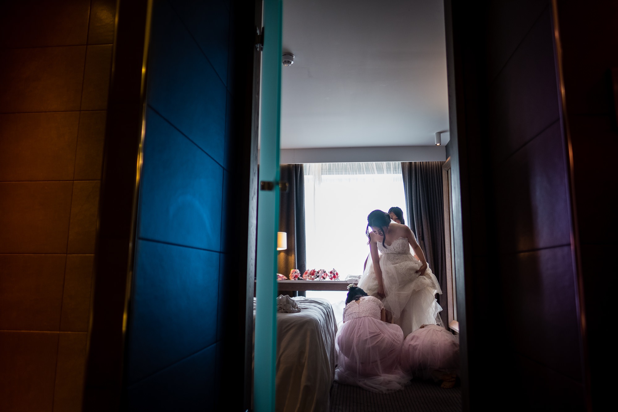 bride getting into dress