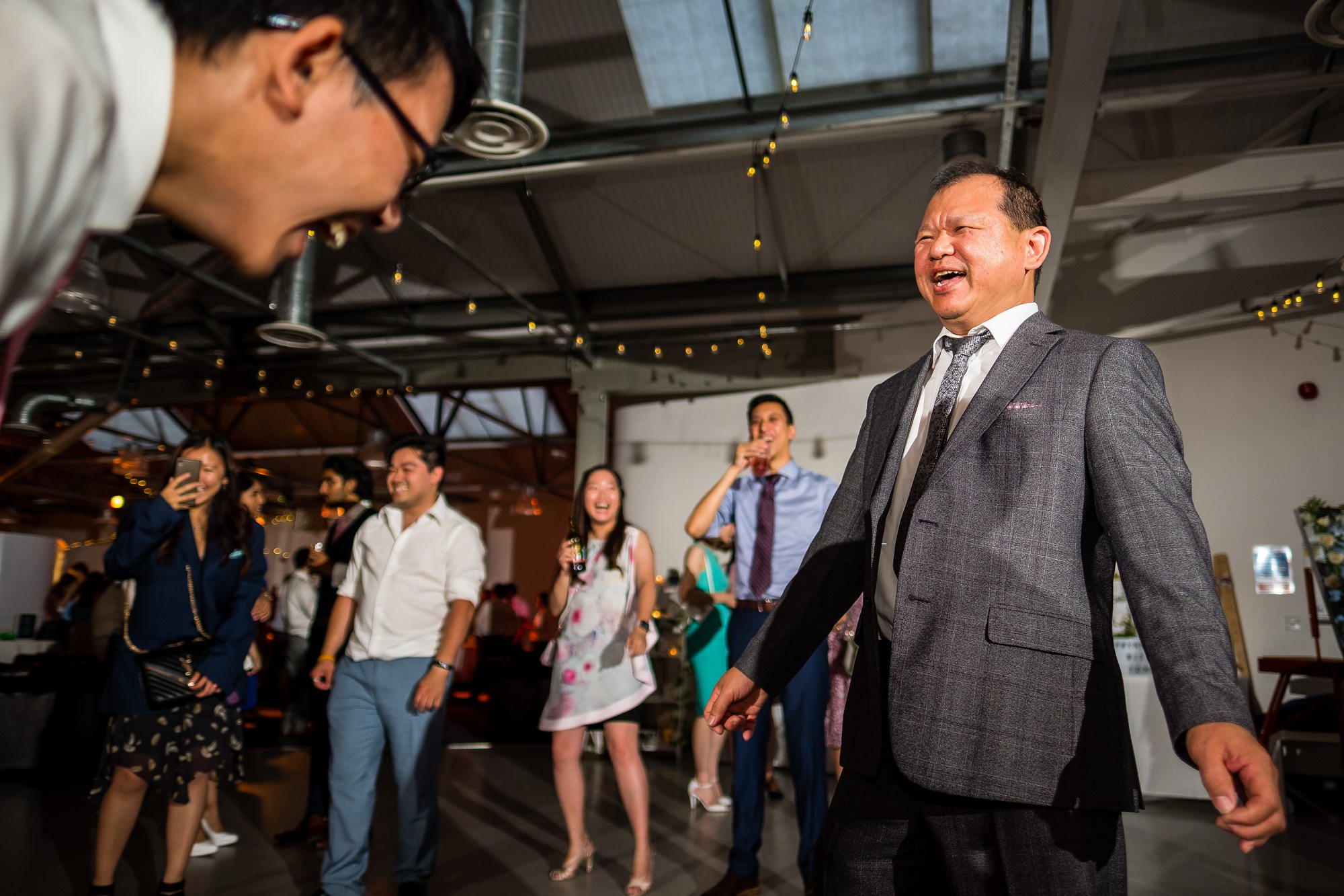 guests laughing on dancefloor