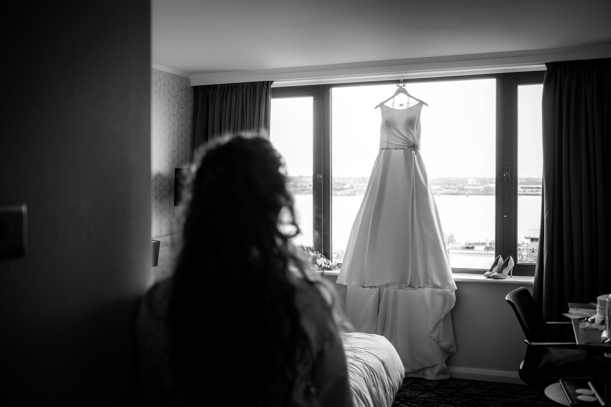 bride looking at wedding dress