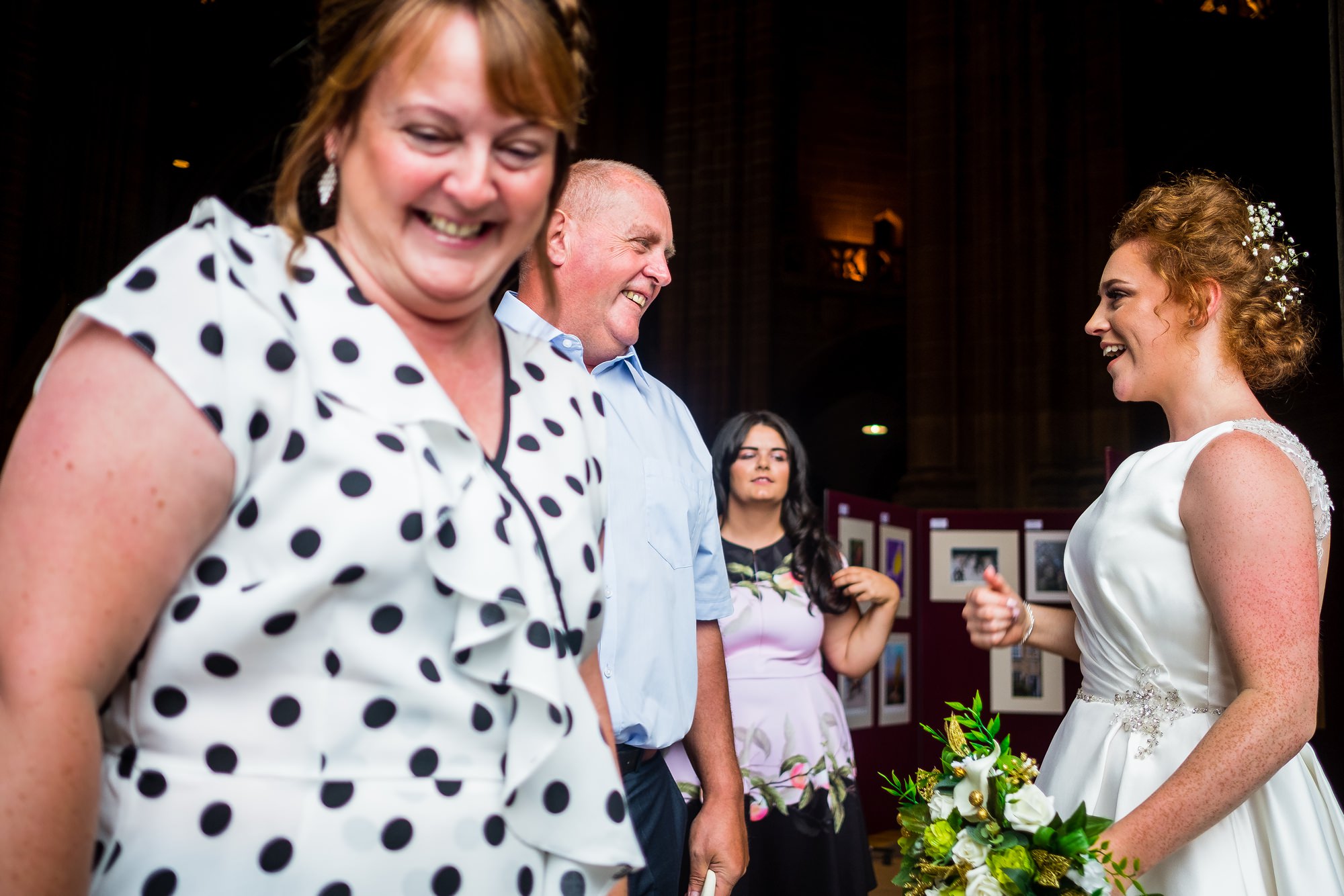 bride greeting guests at the door