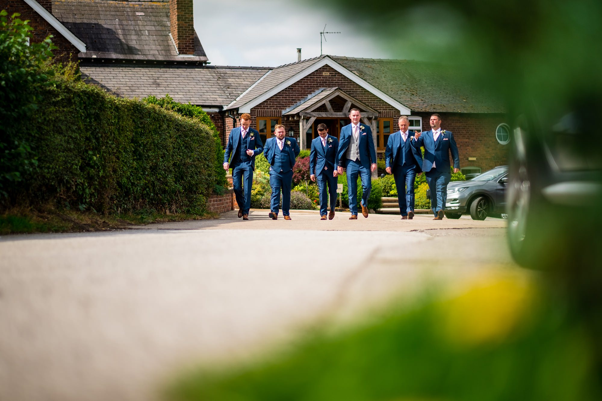 groomsmen walking to the pub