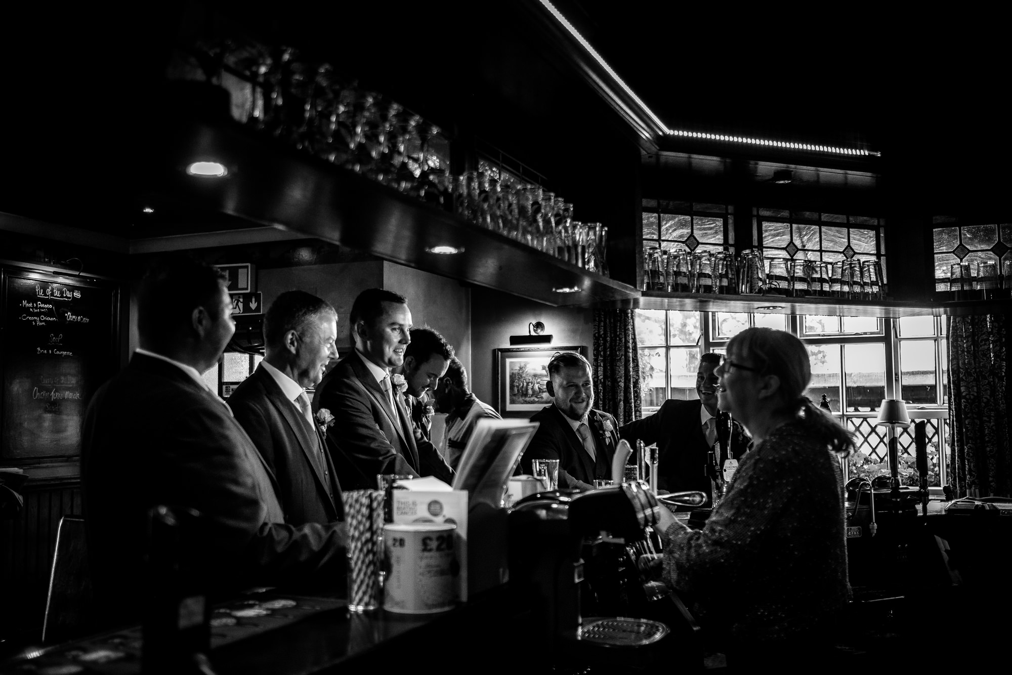 groom at the bar with friends