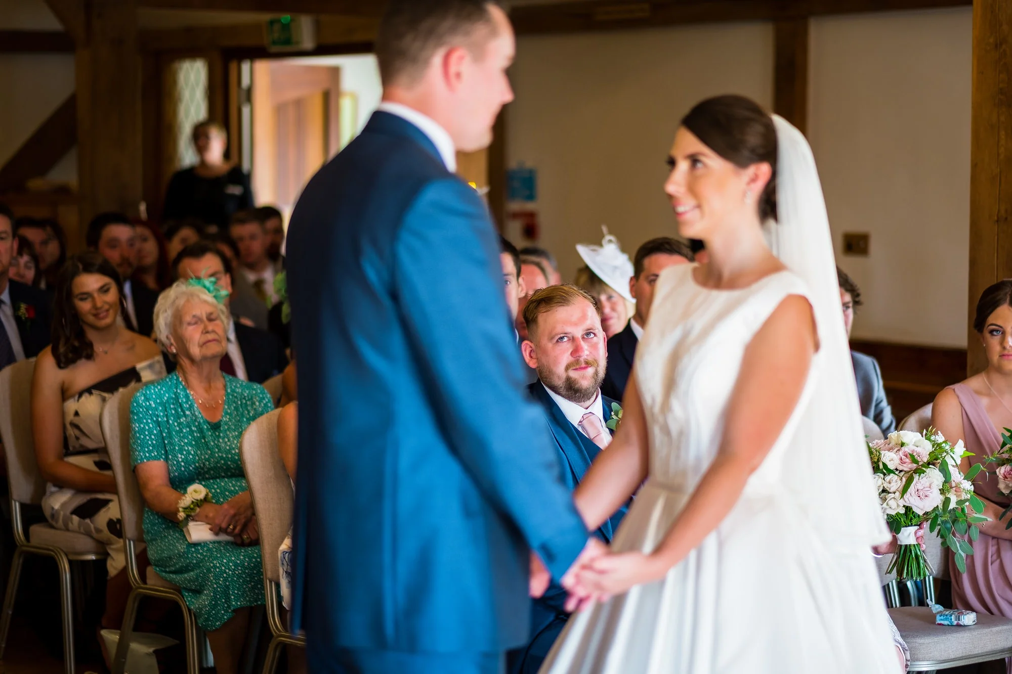 brides brother watching during ceremony