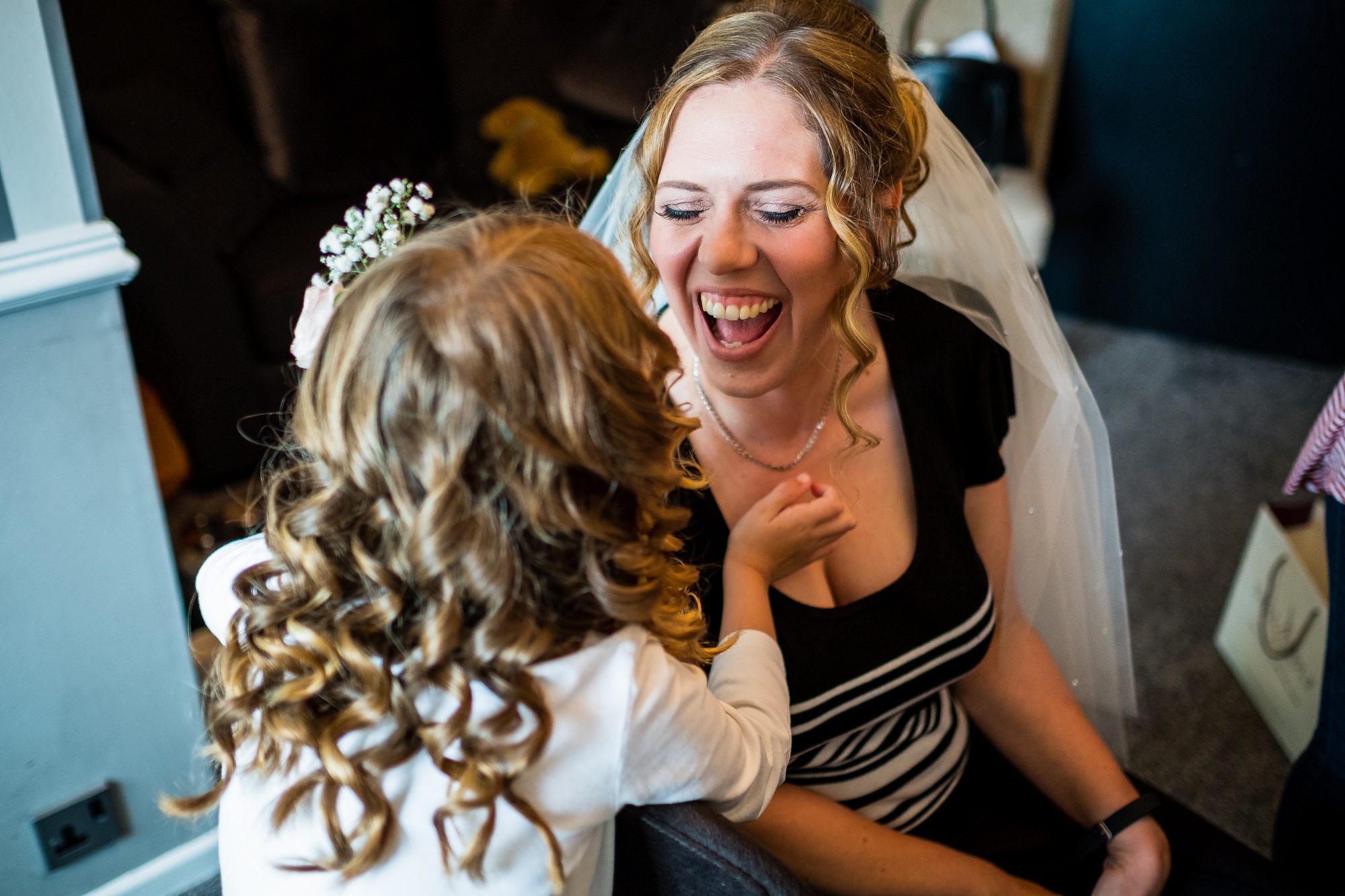 bride laughing with daughter