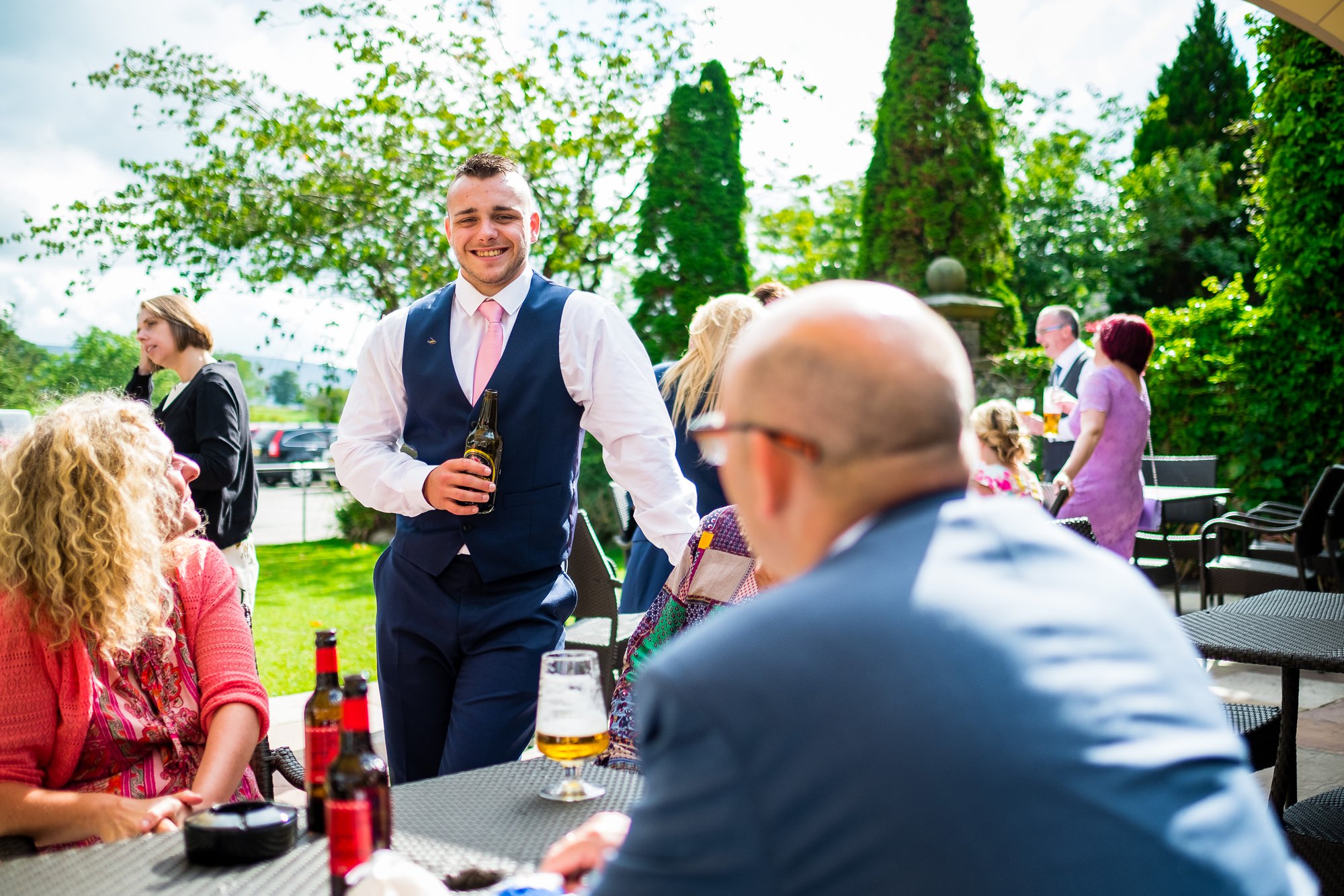guests in sun enjoying a drink