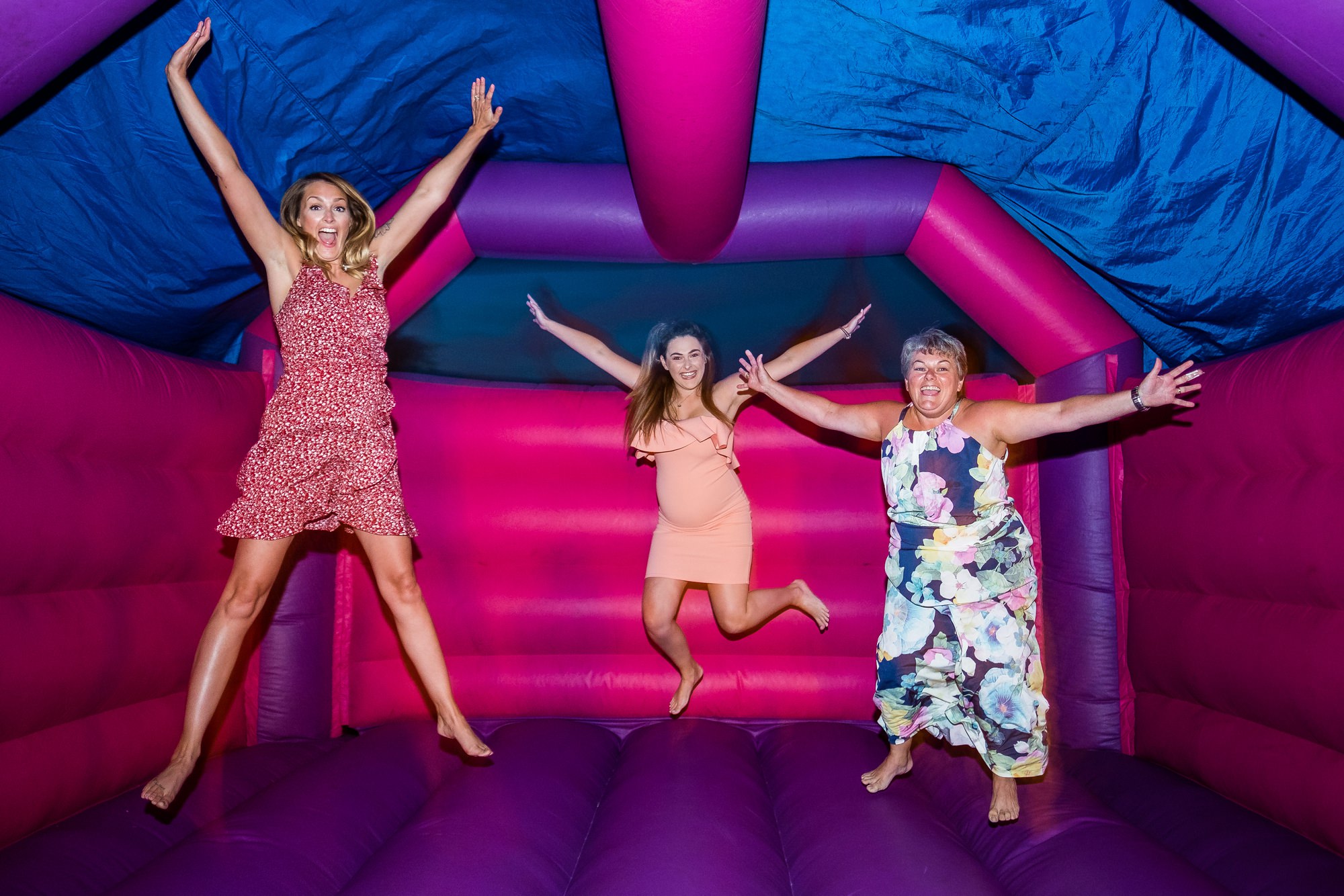 guests on bouncy castle at night