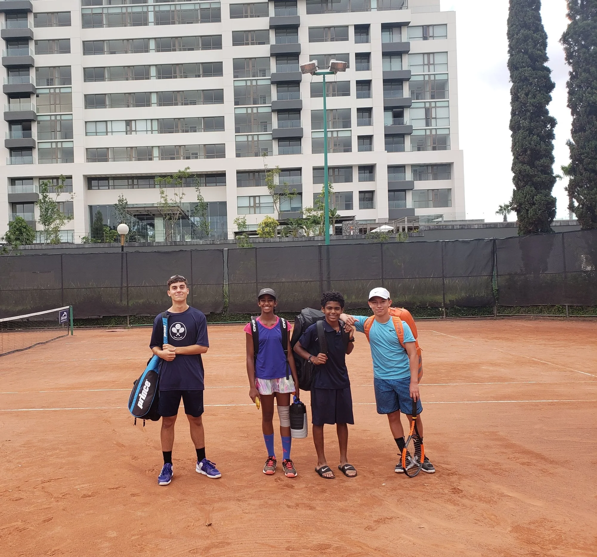 Right to left: Andre (14), Varsha(12), Santiago(13), Stephane(15) on red clay in Zapopan-Guadalajara, Mexico 2018
