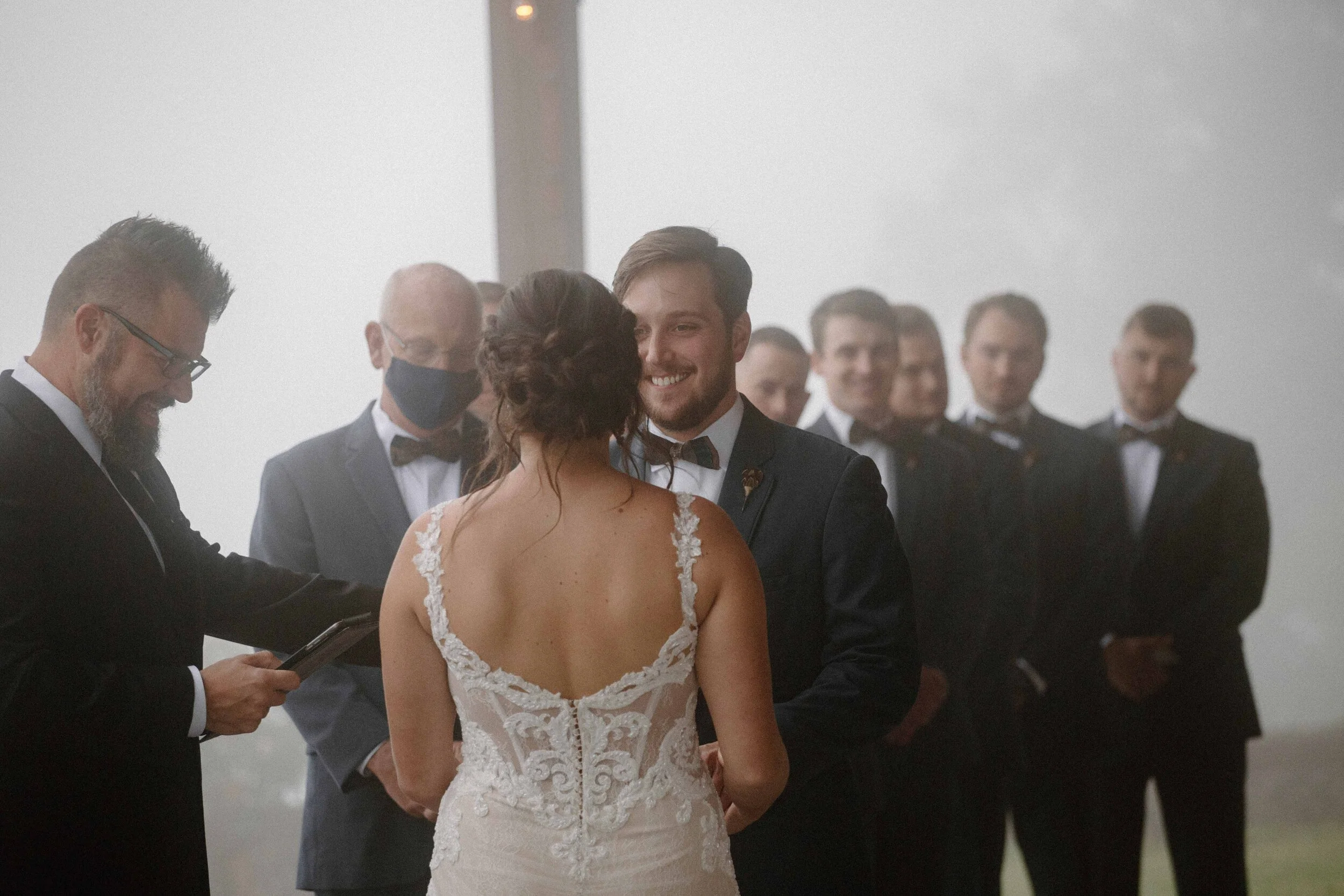 navy groom maroon purple bride groom barn wedding ceremony romantic foggy rainy religious emotional-34.jpg