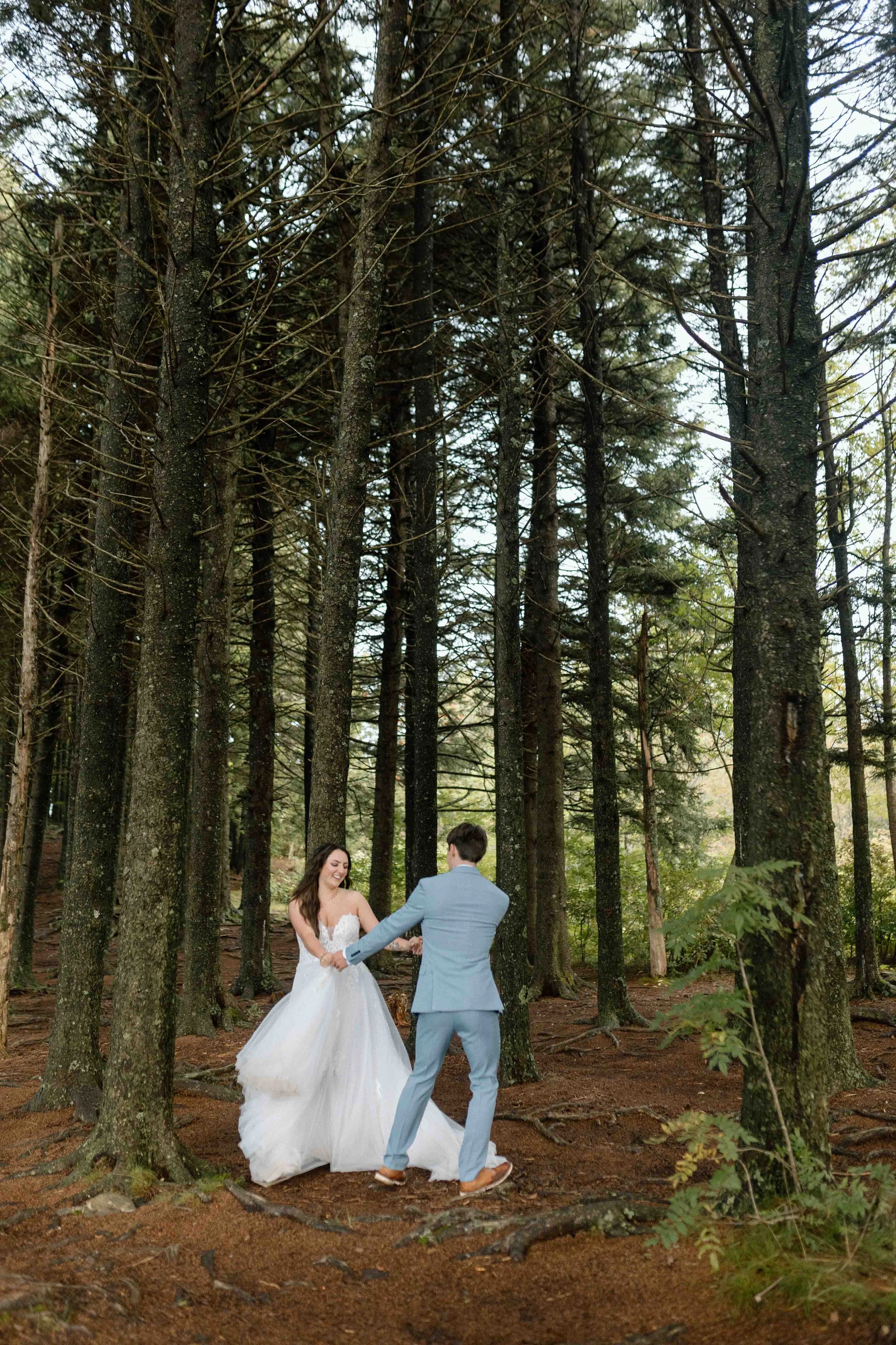 bride and groom dance in an enchanted forest on the blue ridge parkway.