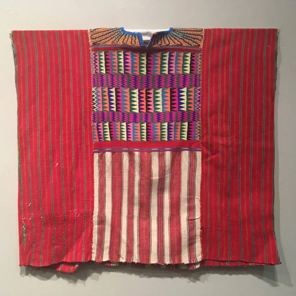 Ceremonial huipil, made of cotton. Mayan Traje at the San Jose Museum of Quilts and Textiles surveys the changing language of traditional dress from the early 20th century to modern day. (Rachael Myrow/KQED)