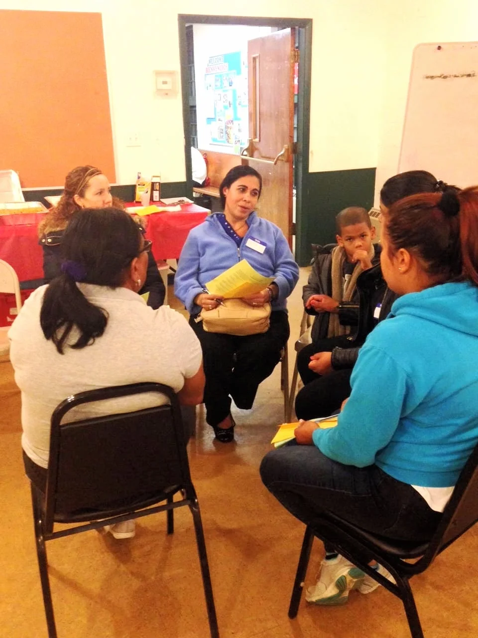 A small group of parents talks about safety in schools
