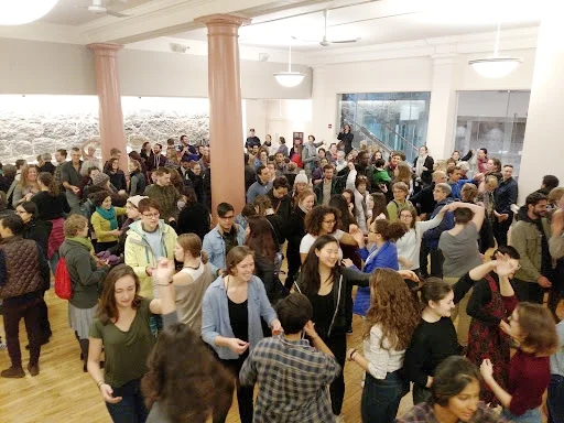 Pre-action salsa lesson in Sproat Hall at the Cathedral of St. Paul