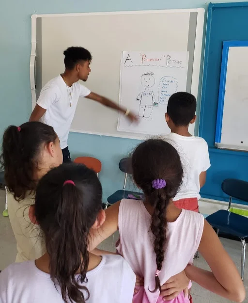 Anthony helping young people define what it takes to be a powerful perso