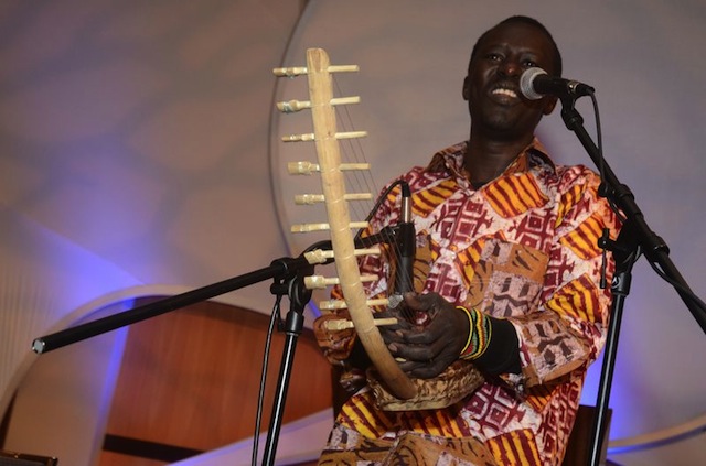 Okello sings, accompanying himself on the adungu. © Jim Berry and Aegis Living