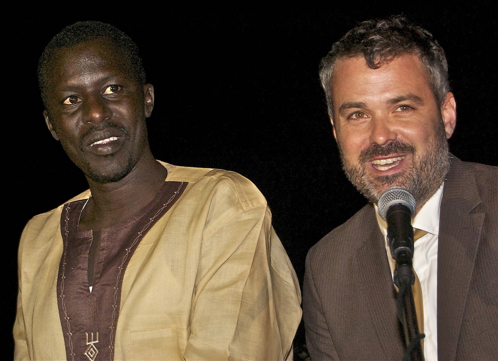 Okello Sam and Chris Talbott introducing Hope North at the Evening of Hope and Happiness (Allan Peach)