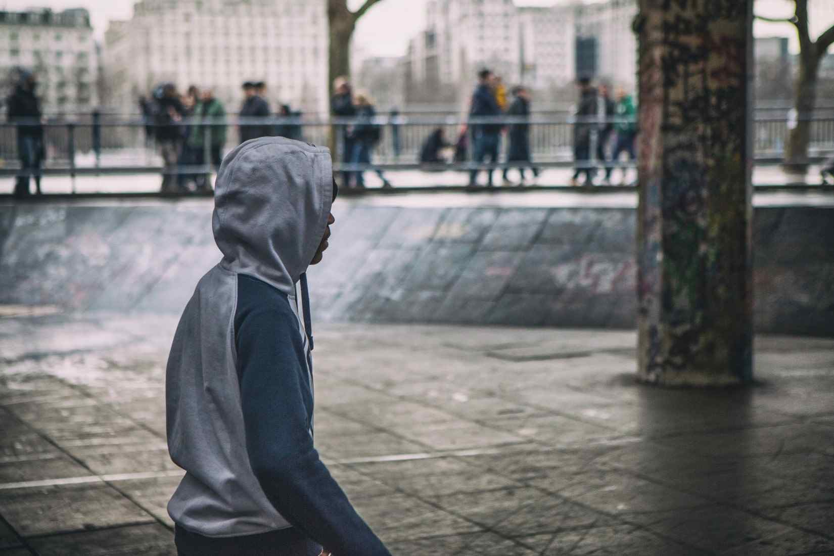 Man practicing mindfulness meditation in a busy urban environment