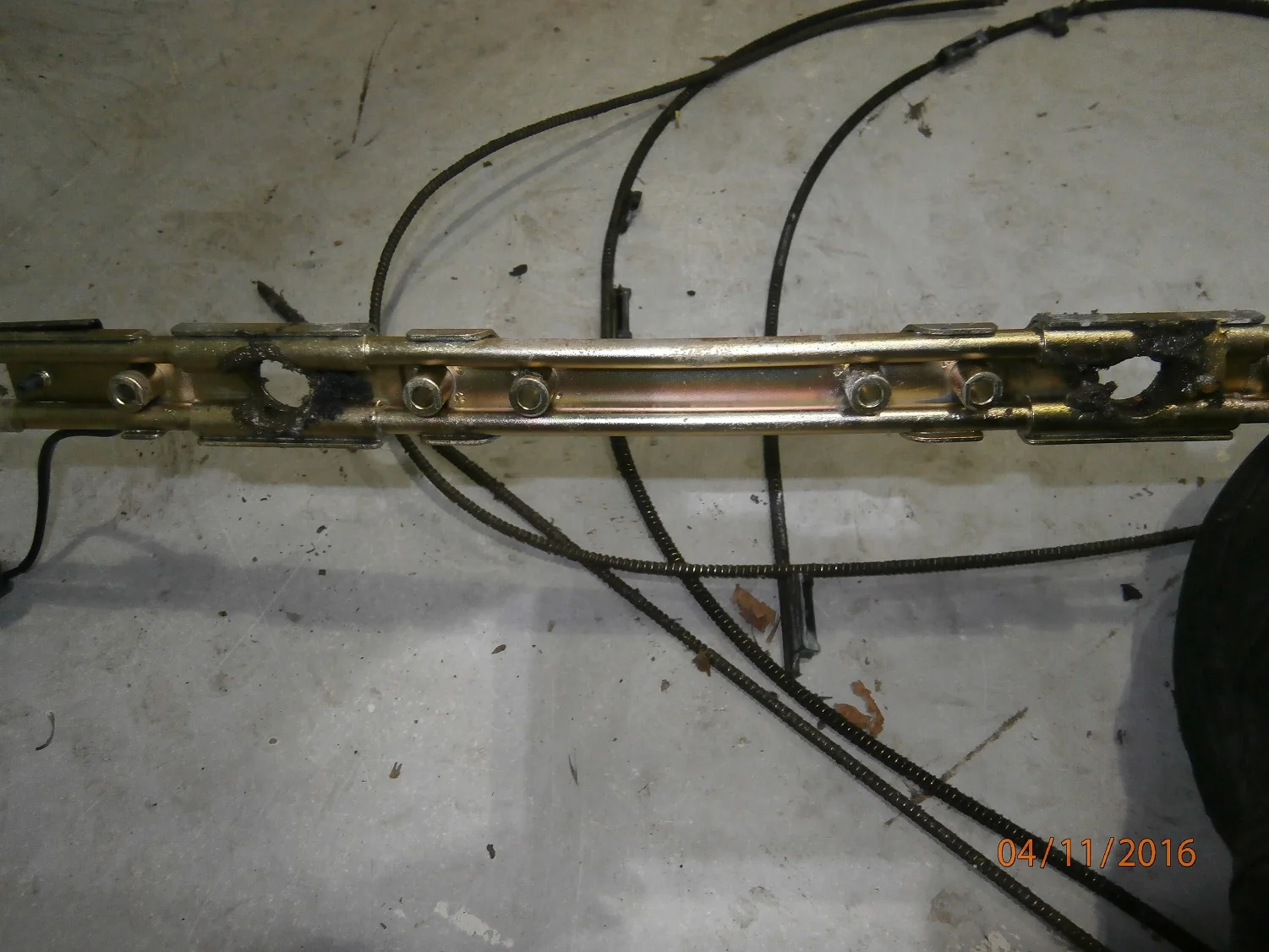 The steel guide for the cables. The outer part is plastic which is where the dirt builds up and splits the guide tube as it tries to drag the cable and dirt along with it.