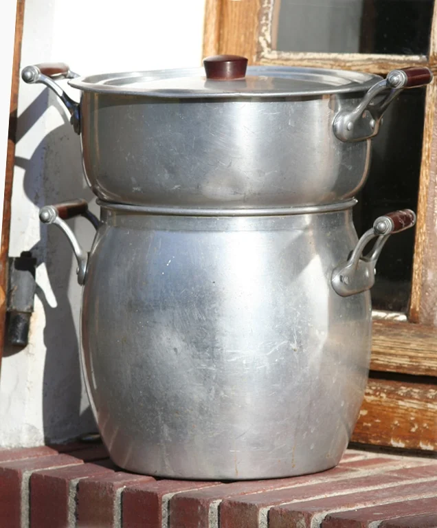 The couscoussier is a traditional two-pot steamer to cook couscous. The bottom pot can also be used for cooking the stew.