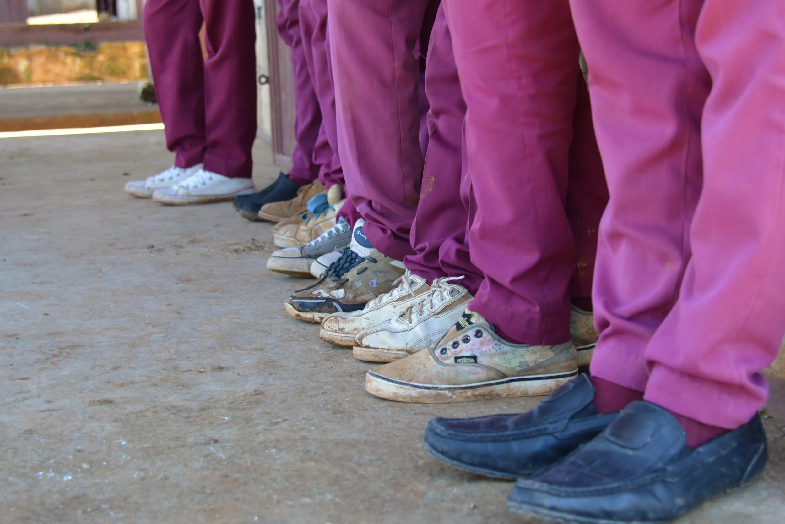 A group of 6th grade boys before getting their new shoes