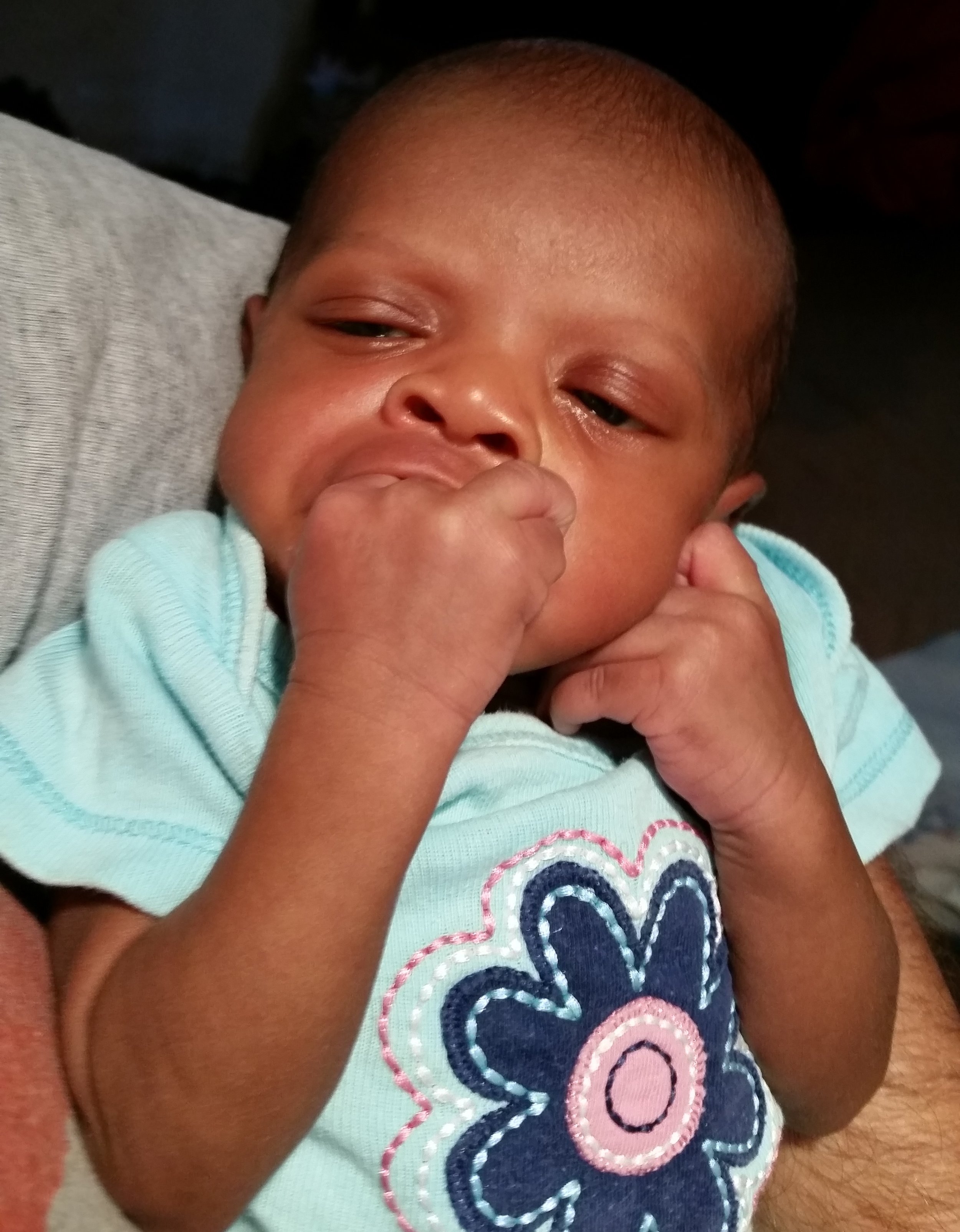 Faeka at 2 weeks - 6 pounds 14 oz. And hungry by the way she was chewing on her hand!!