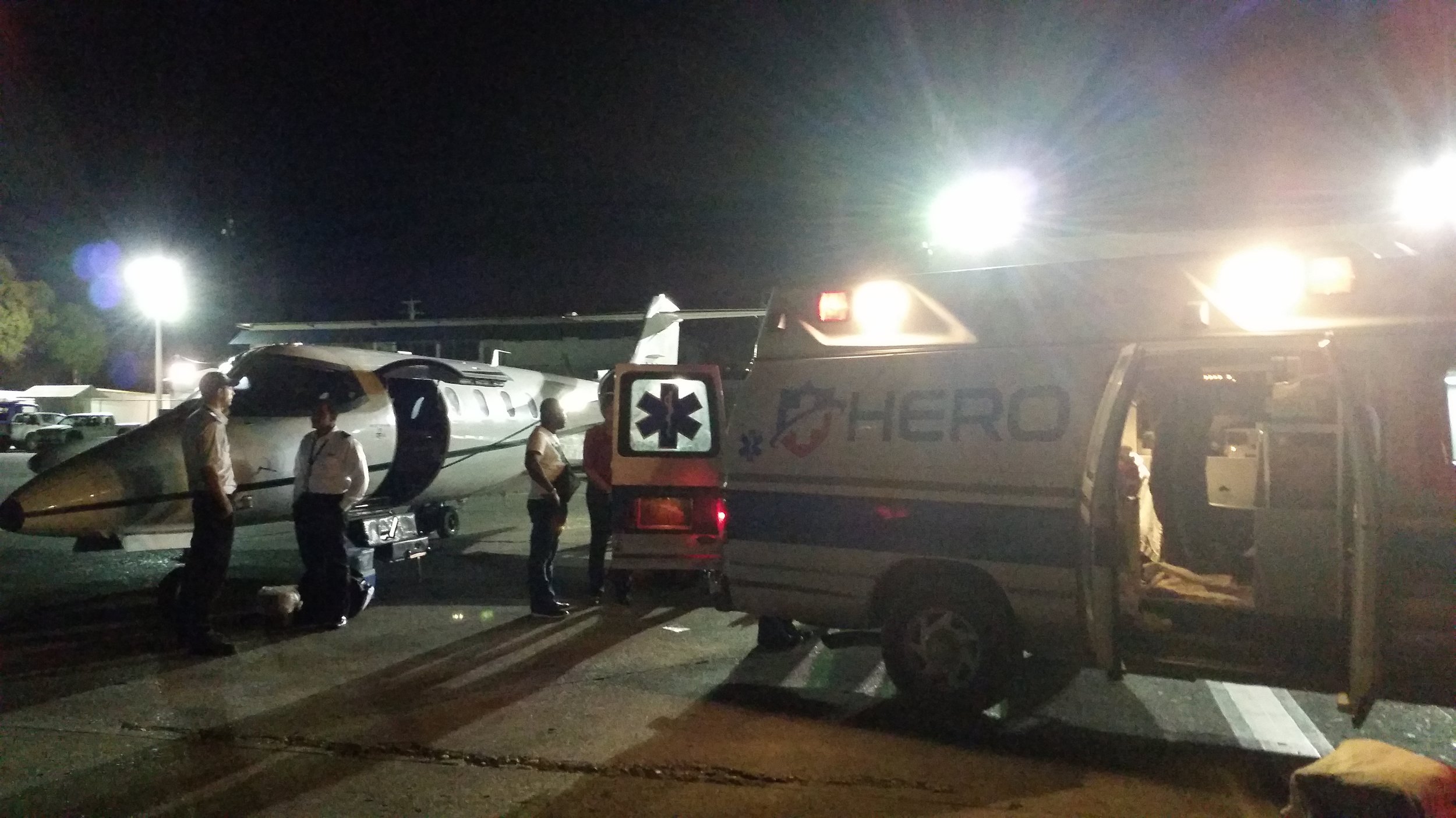 Stabilizing the patient on the tarmac before the flight to Miami.