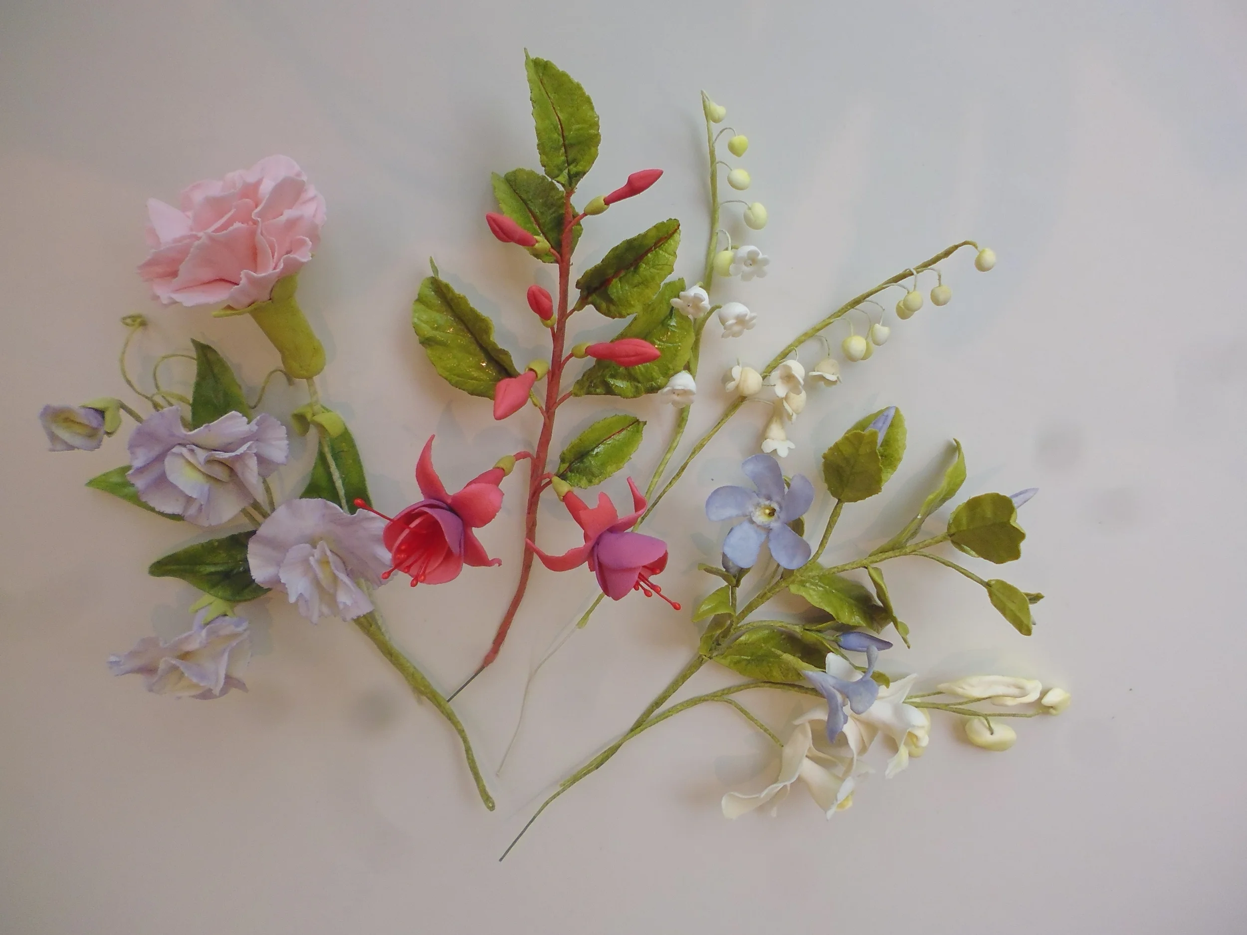 orchid, periwinkle, lily of the valley, fusia, carnation, sweetpea.JPG