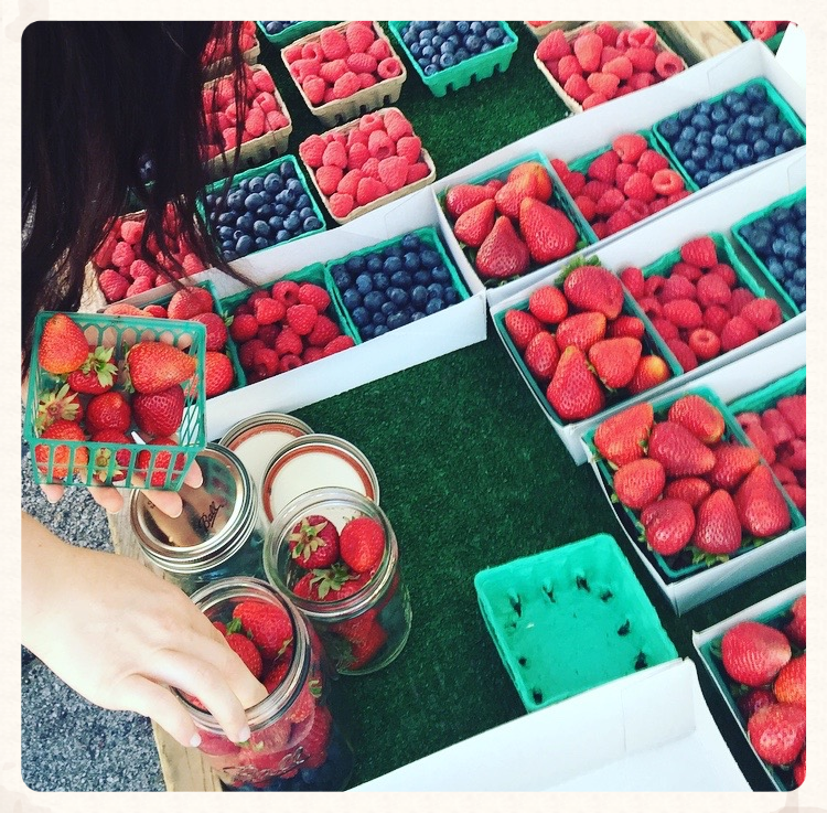 Transferring berries to my glass mason jars, so the farmers can reuse the baskets!