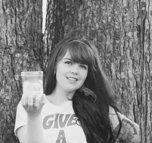 Holding my jar of trash (it does not inlcude the trash that was made when I went to the hospital, dentist, and tattoo shop). Photo by Lauren Frentz . 