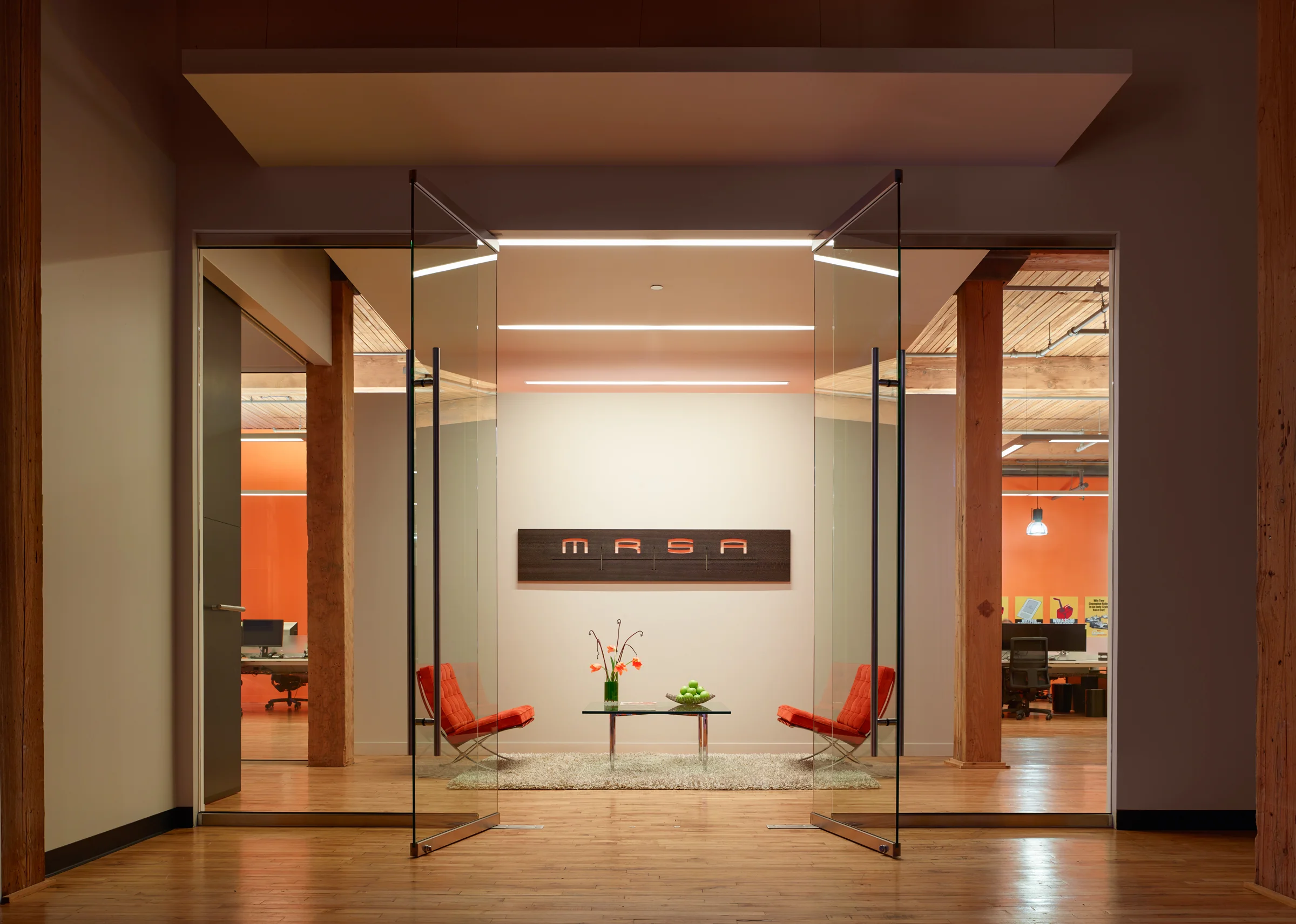 MRSA Architects | Chicago, Illinois MRSA’s current space makes a bold statement about who we are—and how we want to live at work. We were inspired by the afternoon light and the home-like effect of the shadows it produced. But the space needed more than natural light. And we wanted to be both practical and responsible. We recycled lighting, doors, hardware and the like from another project. We donated 5,000 square feet of carpet to a local not-for-profit. And we tapped our contact at a furniture showroom to borrow and ultimately buy the signature orange suede Barcelona chairs that greet every guest. 