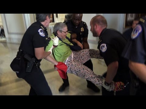 Protesters stage "die-in" outside senate majority leader's office