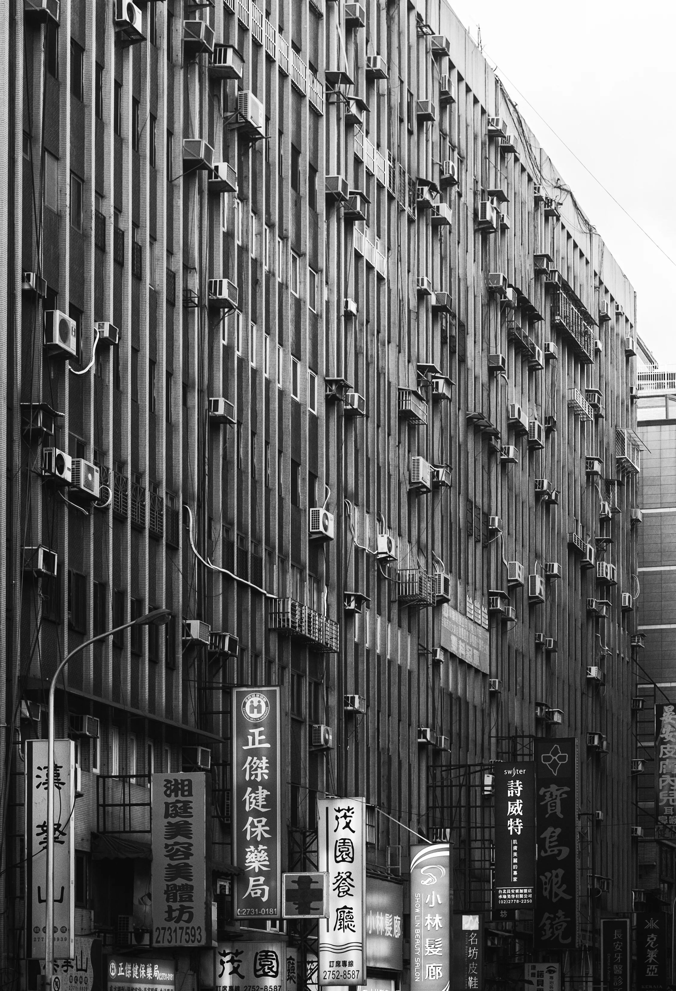 How AC plays a role on taiwanese architectural facades- The protruding AC units on buildings give a sense of population density within an area. 