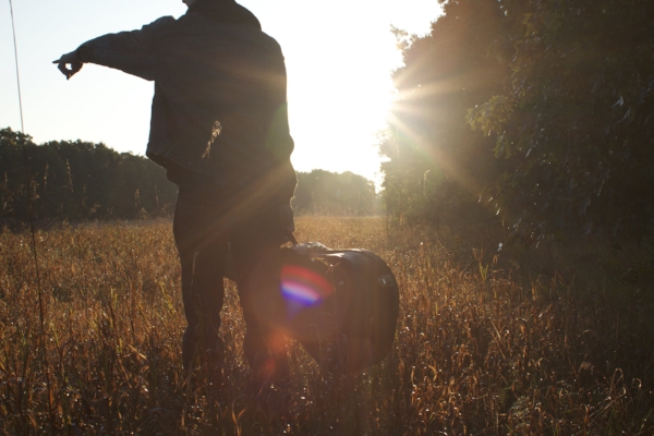 Tristan on a hill in Goffstown, NH while shooting the Wandering Time album cover in 2012. Photo by DSD MEDIA LLC.