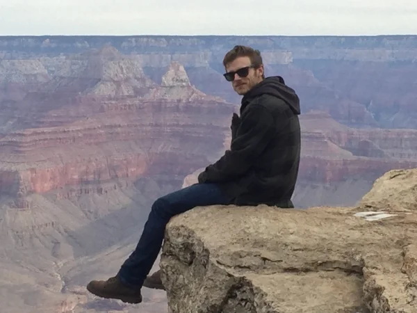 Sitting on the edge of The Grand Canyon in Arizona, December 2016. Photo by: Steven Omand
