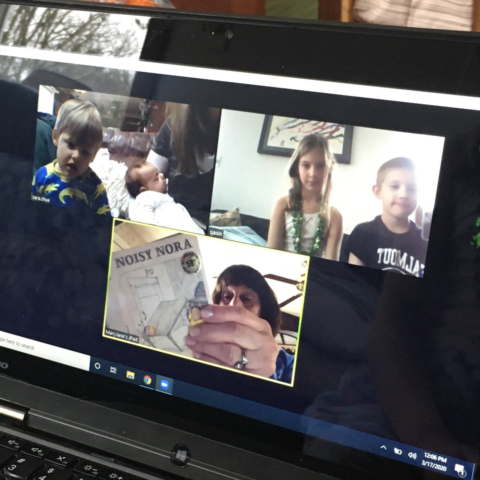 Staci's children share a story with Grandma.