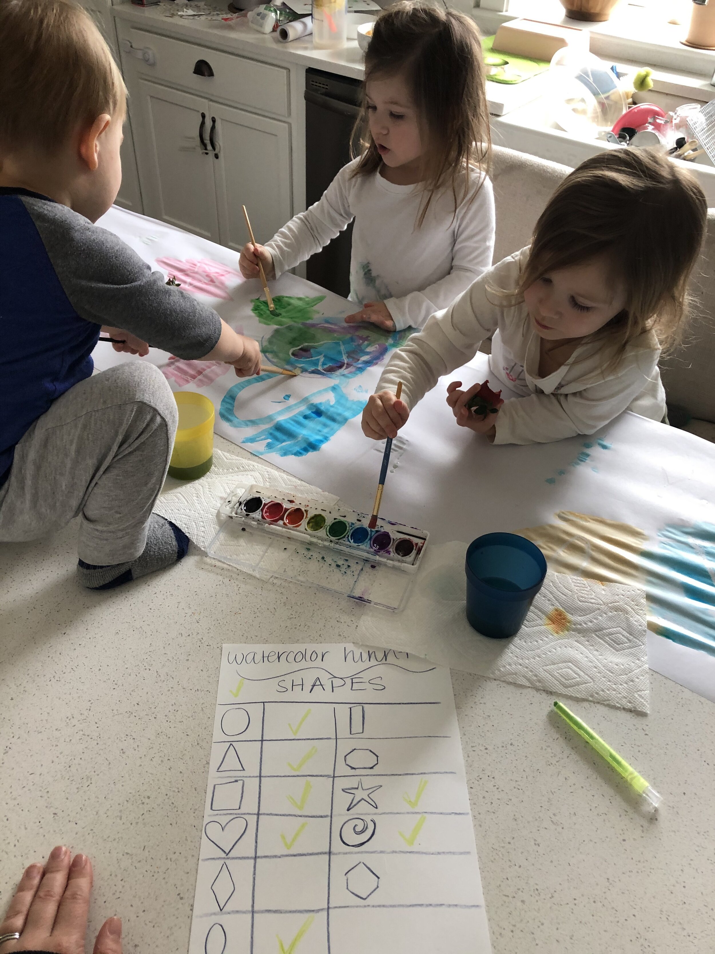 Finding shapes drawn with white crayon.