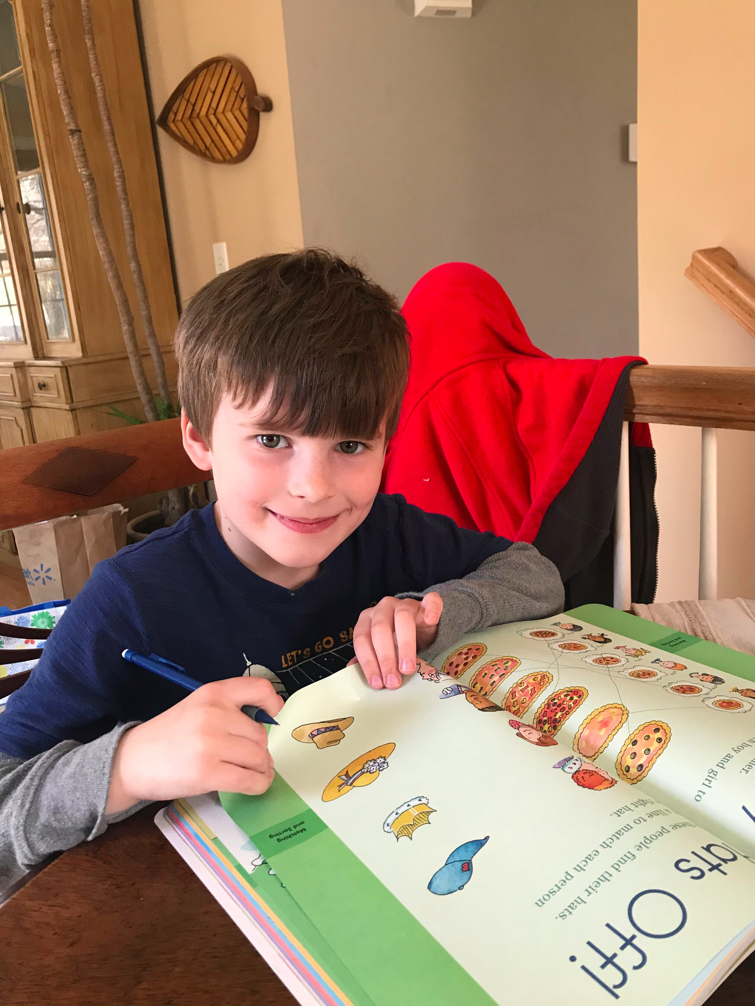 A Children's House Kindergartener busy at work.
