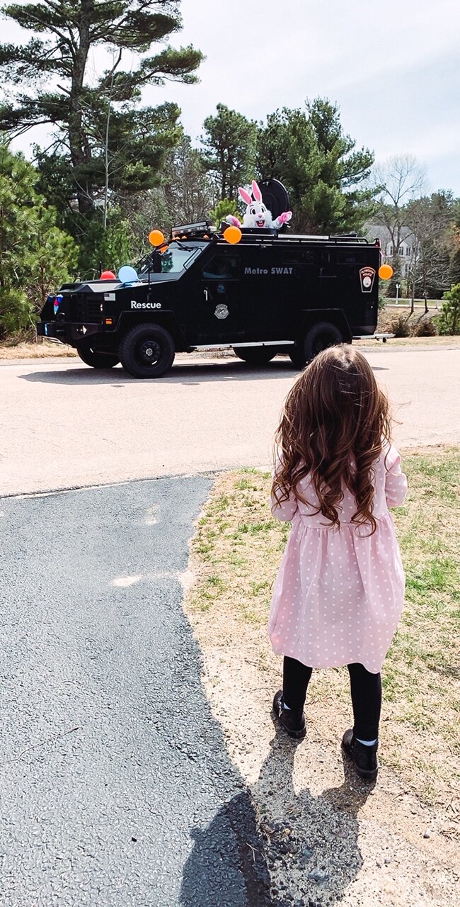 Watching our local helpers parade through the neighborhood.